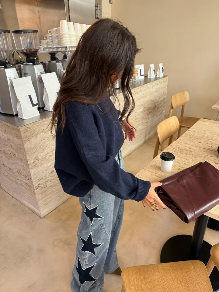 Calças de denim com estrela preta