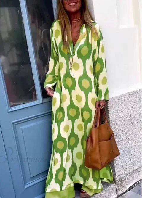 Vestido boho de decote em V com estampado geométrico e abertura
