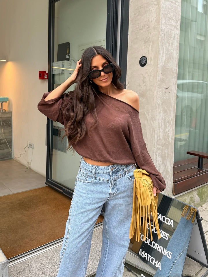 Jeans de denim com tachinhas