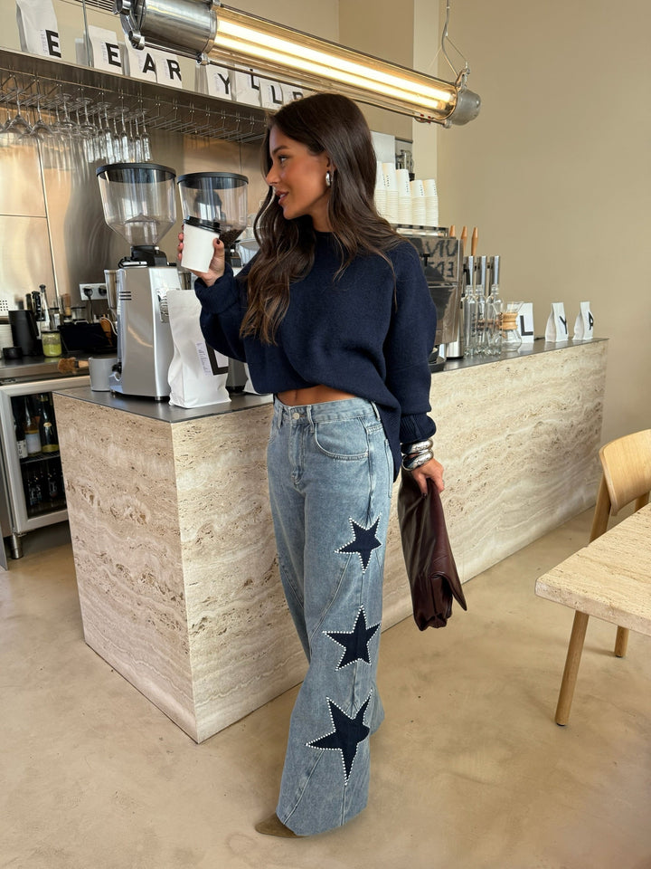 Calças de denim com estrela preta