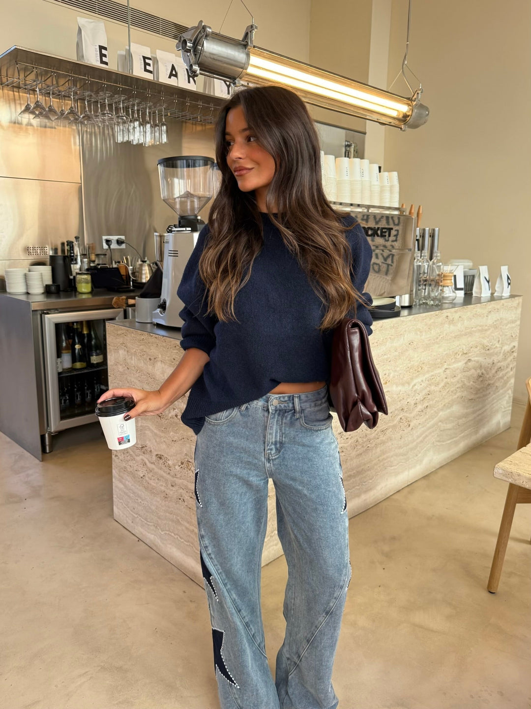 Calças de denim com estrela preta