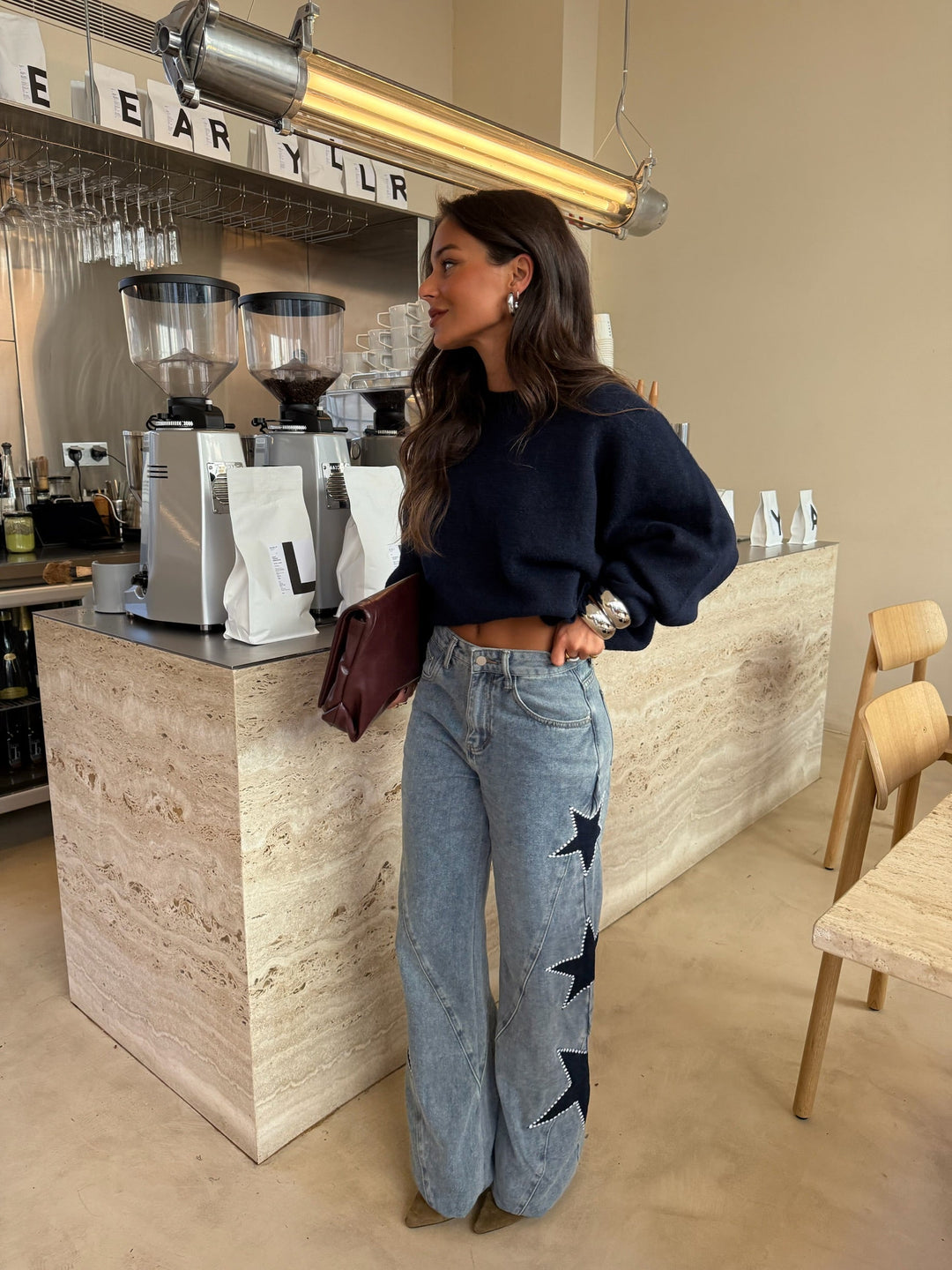 Calças de denim com estrela preta