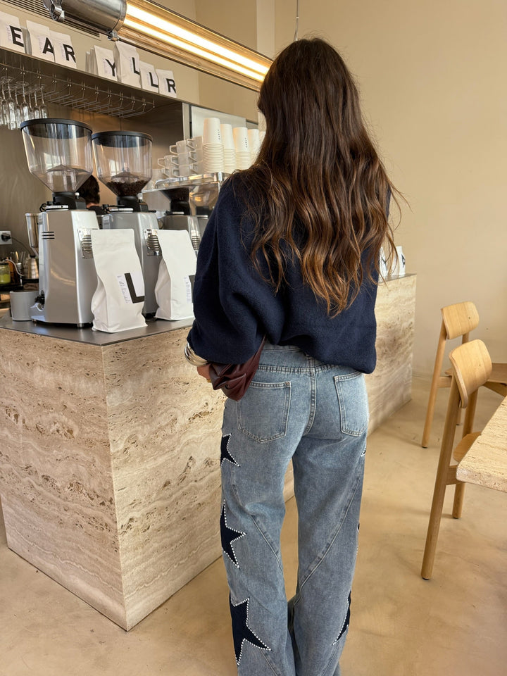 Calças de denim com estrela preta