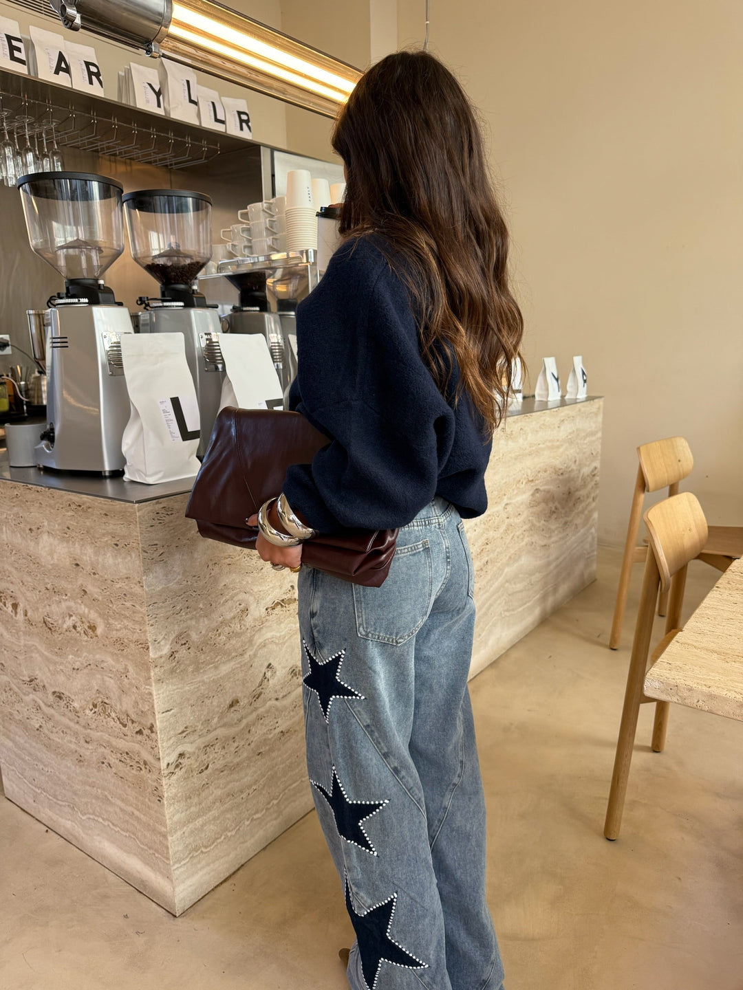 Calças de denim com estrela preta