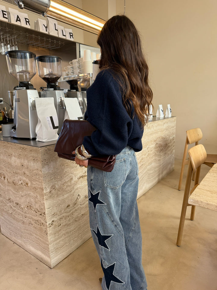 Calças de denim com estrela preta